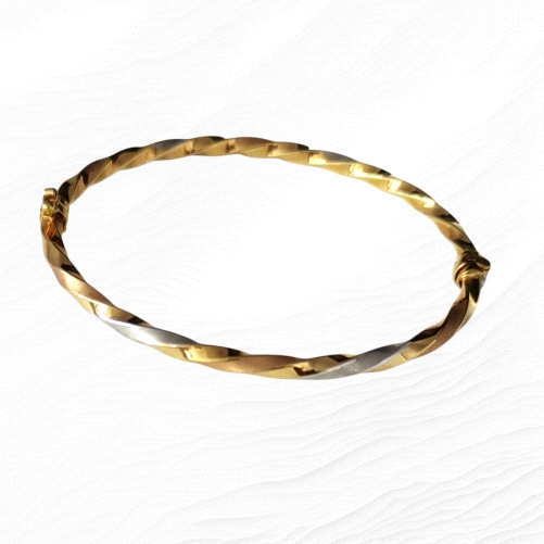 18-karat tricolor gold bangle.