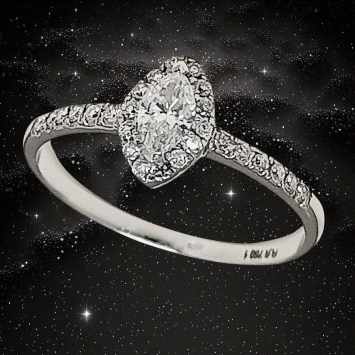 Elegant ring in 18K white gold with a 0.23ct marquise-cut G VS1 solitaire and brilliant cluster diamonds totaling 0.13ct. Sophis