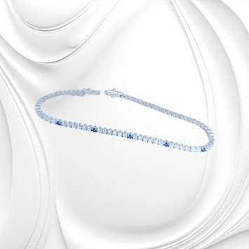 Riviere bracelet in 18K white gold with 2.05ct sapphires and 3.43ct zircons. Elegant, luminous, and 7.5g in weight.