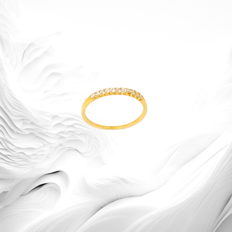 Half eternity ring in 18K yellow gold featuring 11 natural diamonds, total weight 0.17ct. Gracefully lightweight at 1.3g.
