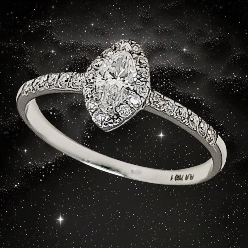 Elegant ring in 18K white gold with a 0.23ct marquise-cut G VS1 solitaire and brilliant cluster diamonds totaling 0.13ct. Sophis