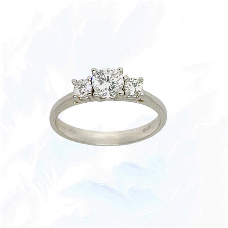 Trilogy ring in 18K white gold featuring lab diamonds: centre stone 0.45ct and sides totalling 0.24ct.