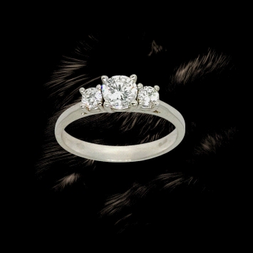 Trilogy ring in 18K white gold featuring lab diamonds: centre stone 0.45ct and sides totalling 0.24ct.