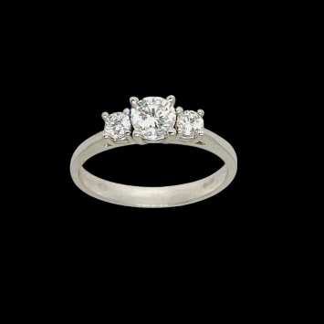 Trilogy ring in 18K white gold featuring lab diamonds: centre stone 0.45ct and sides totalling 0.24ct.