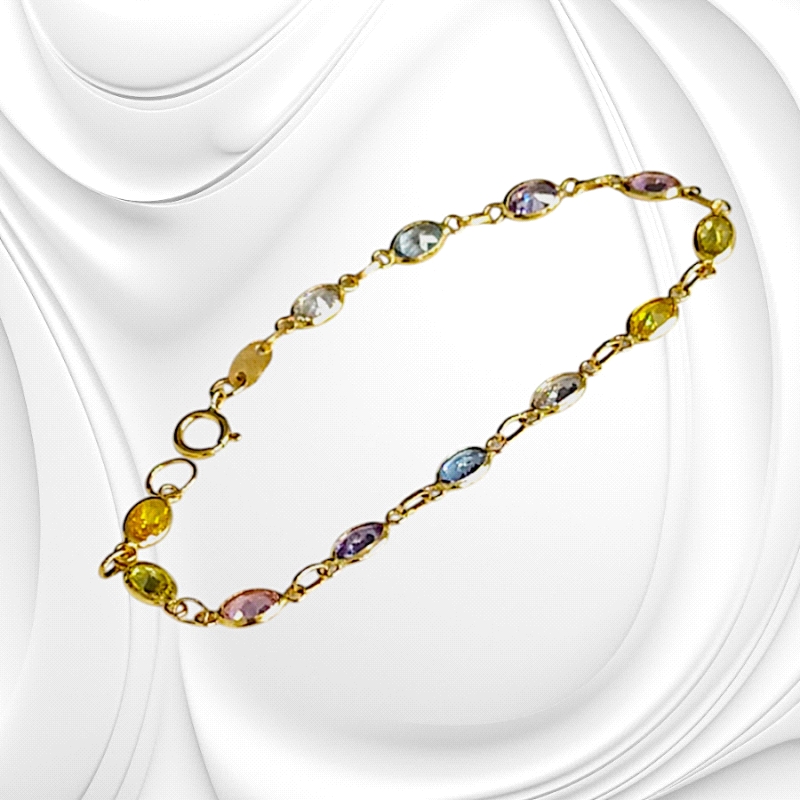 Elegant 18K gold bracelet weighing 3g, adorned with coloured zircon stones. A radiant piece for refined daily wear.