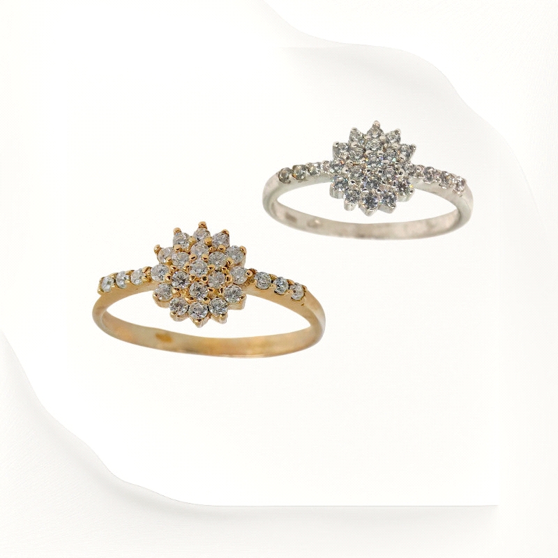 Floral cluster ring in 9K gold with zirconias along the band. Available in white or yellow gold. Price shown is for one ring. Floral cluster ring in 9K gold with zirconias along the band. Available in white or yellow gold. Price shown is for one ring.