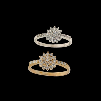 Floral cluster ring in 9K gold with zirconias along the band. Available in white or yellow gold. Price shown is for one ring.