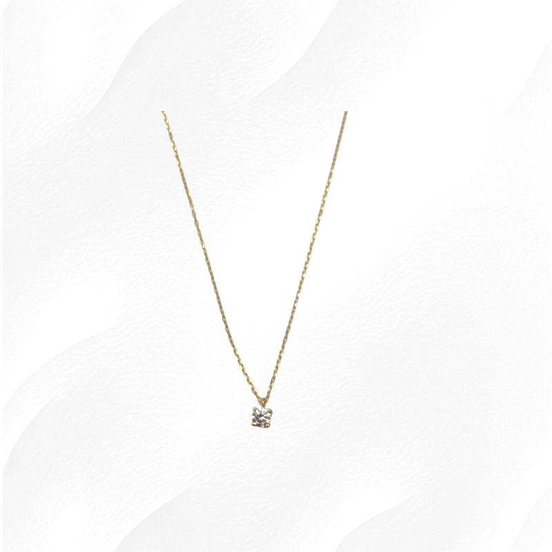 9K yellow gold necklace with 0.5ct zircon solitaire pendant. Weight: 1.5g