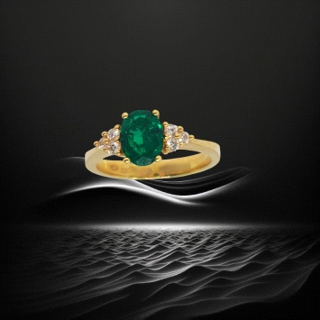 18K yellow gold ring with 1.21ct oval emerald and six diamonds. Weight: 0.15ct total.