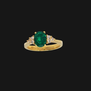 18K yellow gold ring with 1.21ct oval emerald and six diamonds. Weight: 0.15ct total.